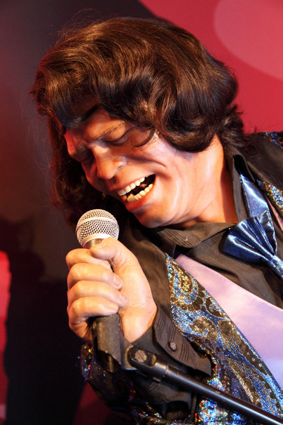 James Brown wax figure singing with microphone